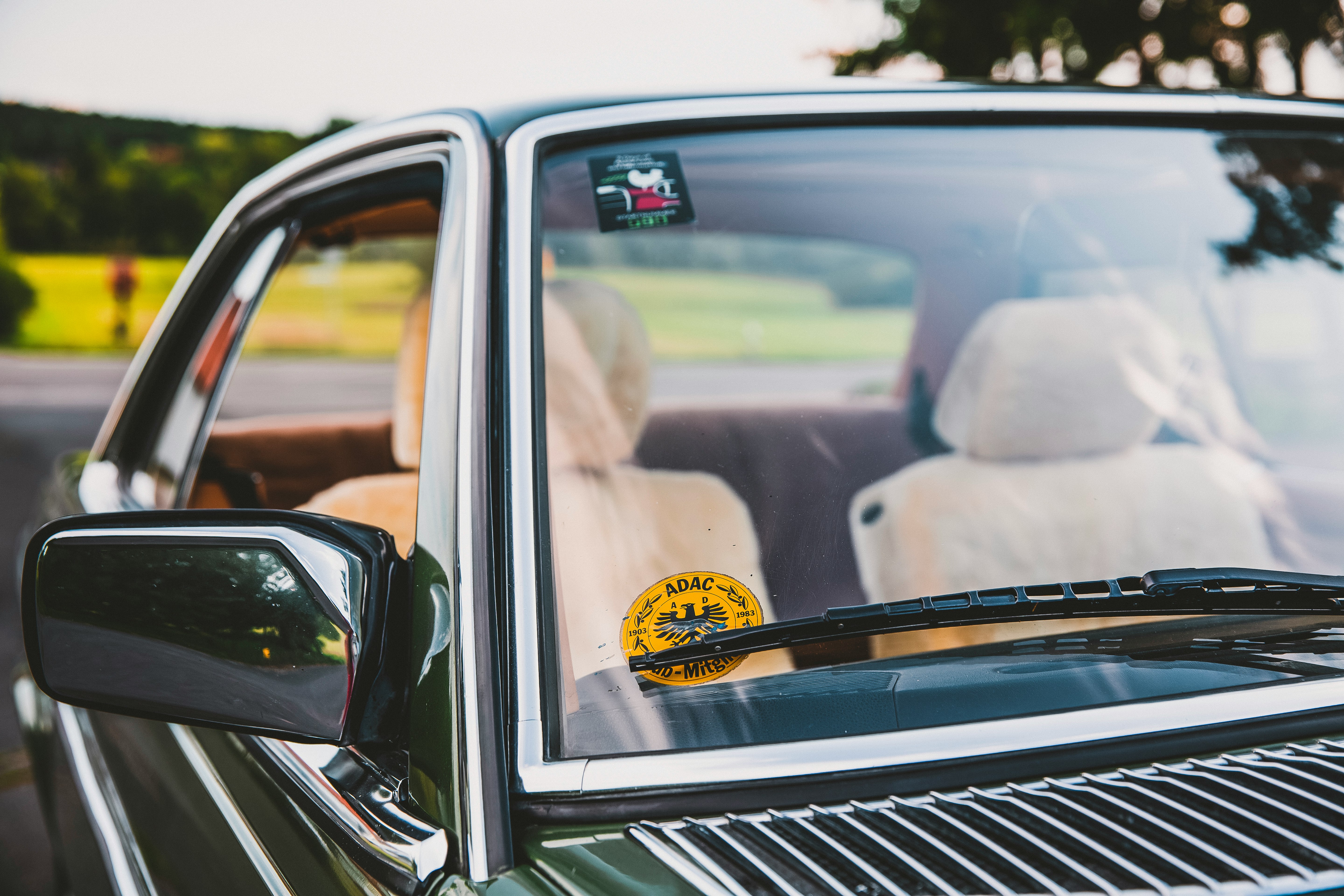 green coupe vehicle